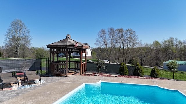 view of swimming pool featuring a fenced in pool, a gazebo, and fence