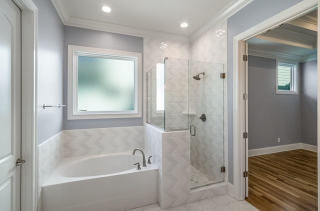 full bath featuring a bath, baseboards, wood finished floors, a shower stall, and crown molding
