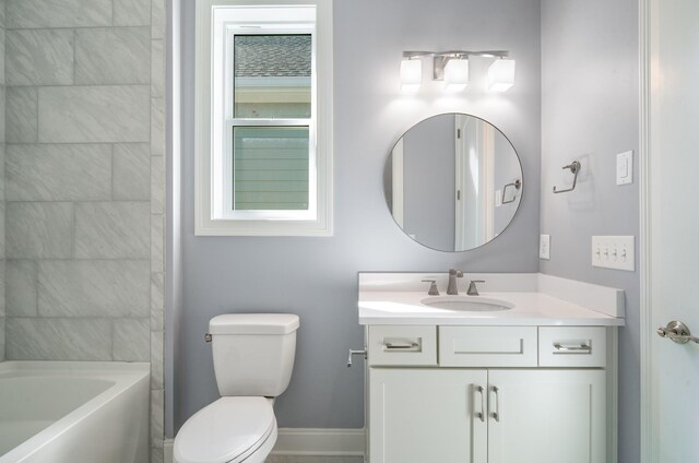 full bath featuring shower / bathing tub combination, toilet, vanity, and baseboards