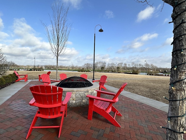 view of patio featuring an outdoor fire pit