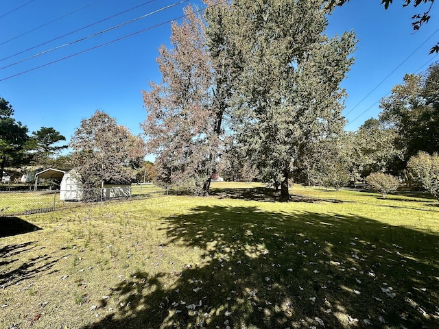273 Chapel Rd, New Johnsonville, TN 37134 - view of yard featuring a carport and fence