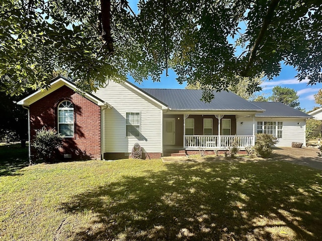 273 Chapel Rd, New Johnsonville, TN 37134 - ranch-style home featuring a front lawn, crawl space, metal roof, and covered porch
