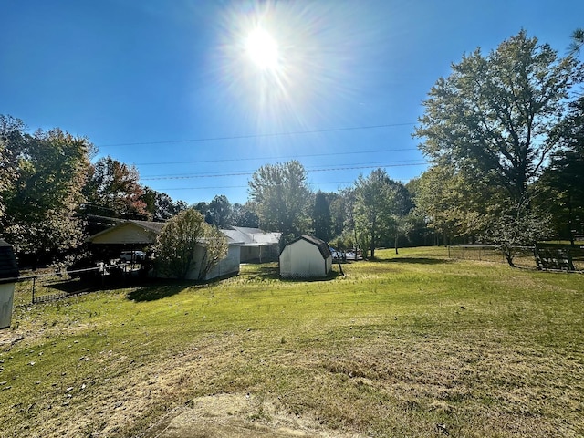 273 Chapel Rd, New Johnsonville, TN 37134 - view of yard featuring an outbuilding, fence, and a shed
