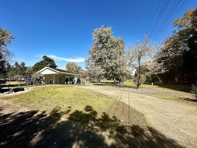273 Chapel Rd, New Johnsonville, TN 37134 - view of yard featuring driveway and a carport