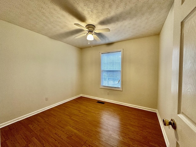 273 Chapel Rd, New Johnsonville, TN 37134 - empty room featuring baseboards, visible vents, a ceiling fan, and dark wood finished floors