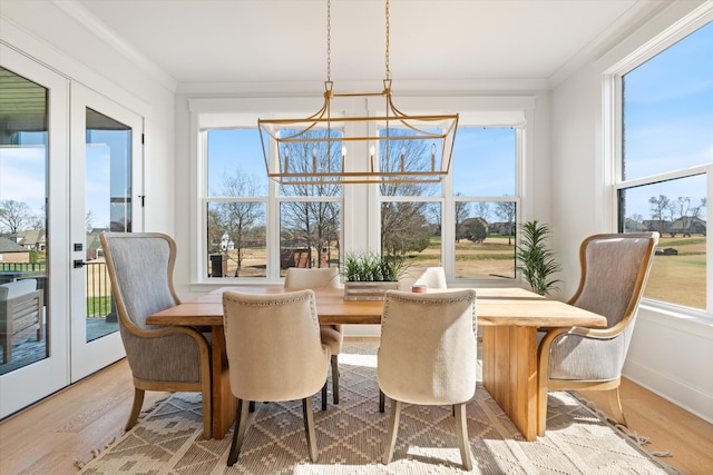 1428 Boardwalk Pl, Gallatin, TN 37066 - dining room featuring an inviting chandelier, crown molding, and wood finished floors