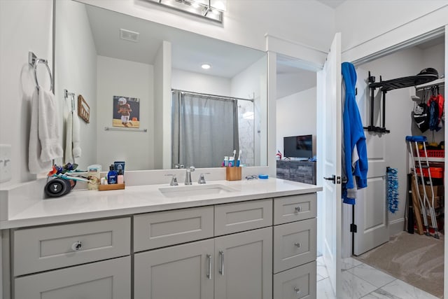 1428 Boardwalk Pl, Gallatin, TN 37066 - full bath featuring marble finish floor, a walk in closet, visible vents, and vanity