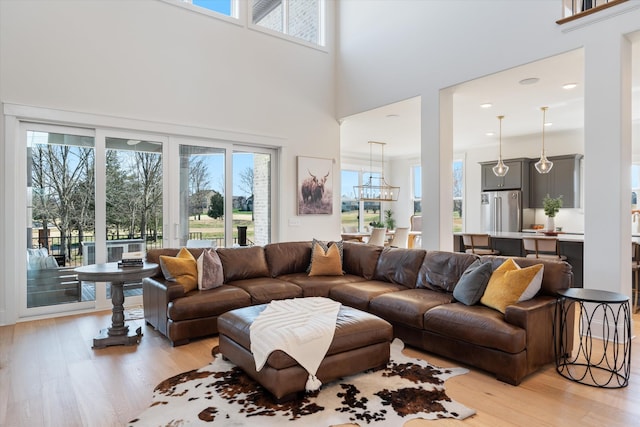 1428 Boardwalk Pl, Gallatin, TN 37066 - living area featuring an inviting chandelier, light wood-style flooring, and plenty of natural light