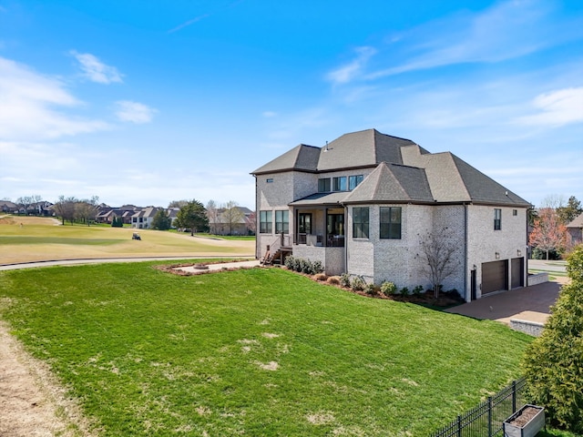 1428 Boardwalk Pl, Gallatin, TN 37066 - view of side of home featuring driveway, a garage, and a lawn