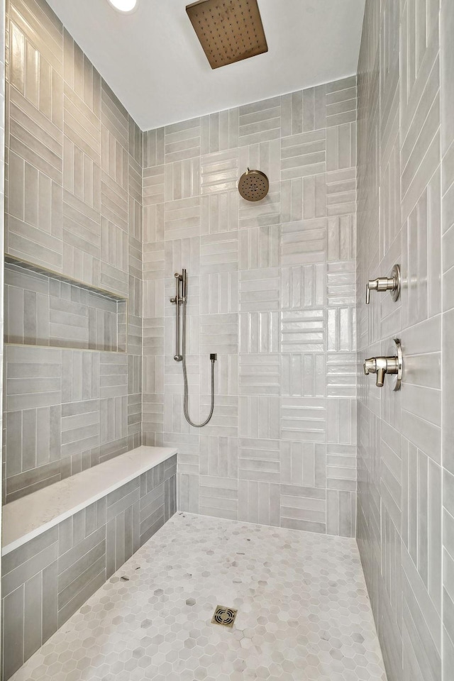 bathroom with a tile shower