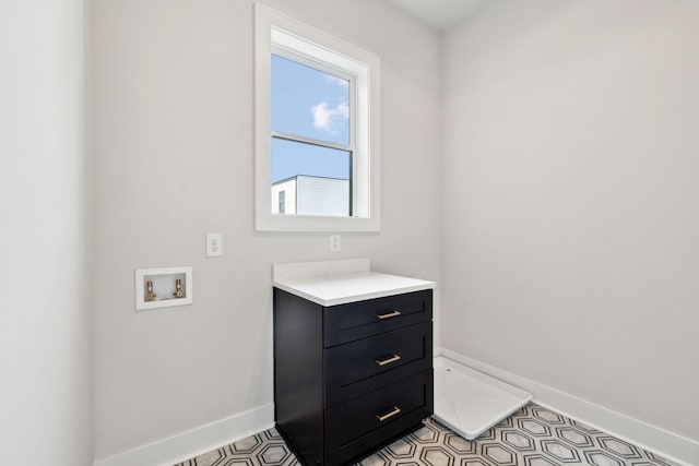 bathroom featuring vanity and baseboards