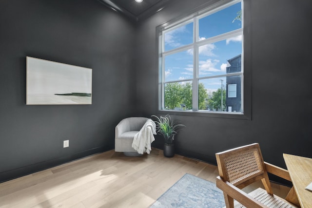 sitting room with wood finished floors and baseboards