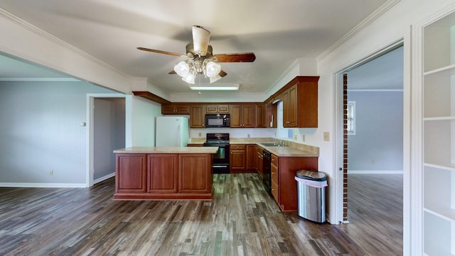 411 Whaley St, Smithville, TN 37166 - kitchen with black appliances, dark wood-style flooring, light countertops, and ornamental molding