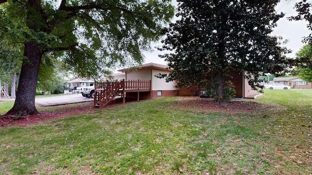 411 Whaley St, Smithville, TN 37166 - back of house featuring a deck and a yard
