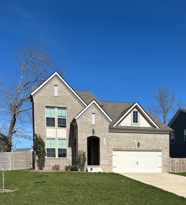 traditional home with brick siding, concrete driveway, and a garage