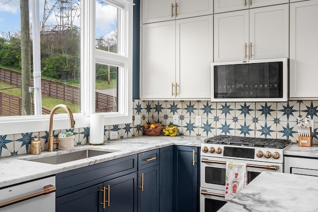 3118 Trevor St, Nashville, TN 37209 - kitchen featuring a sink, decorative backsplash, range with gas stovetop, and dishwasher