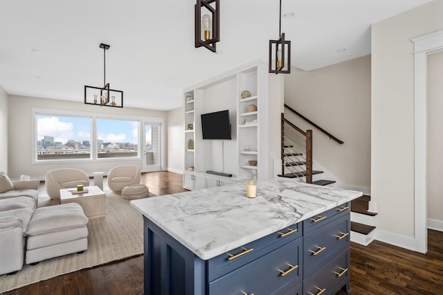 3118 Trevor St, Nashville, TN 37209 - kitchen featuring baseboards, an inviting chandelier, open floor plan, blue cabinetry, and dark wood-type flooring