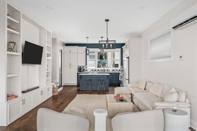 3118 Trevor St, Nashville, TN 37209 - living area featuring built in shelves, a wall unit AC, and dark wood finished floors