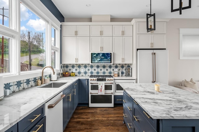 3118 Trevor St, Nashville, TN 37209 - kitchen with a sink, high end appliances, blue cabinets, and white cabinets