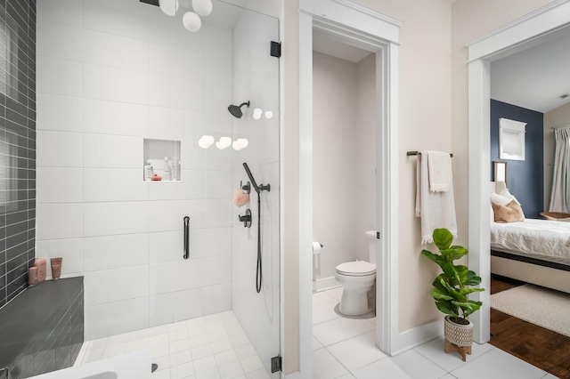 3118 Trevor St, Nashville, TN 37209 - ensuite bathroom with ensuite bathroom, baseboards, toilet, tile patterned flooring, and a stall shower