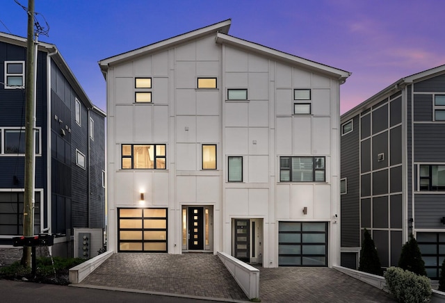 3118 Trevor St, Nashville, TN 37209 - contemporary home featuring board and batten siding, a garage, and decorative driveway