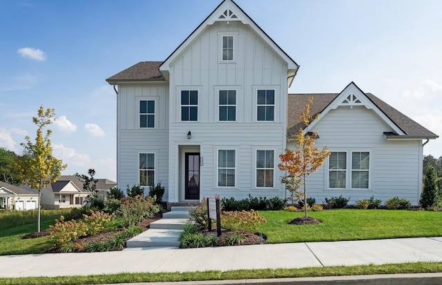 3021 Fanshaw Rd, Smyrna, TN 37167 - view of front facade with a front lawn, board and batten siding, and a shingled roof