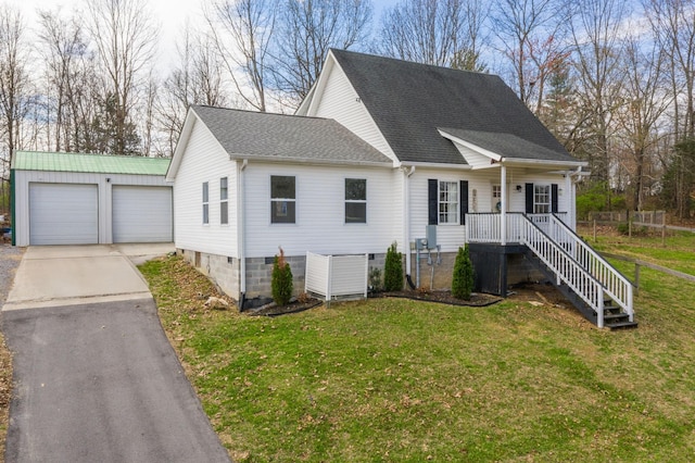1613 Kelly Willis Rd, Greenbrier, TN 37073 - view of front of house featuring a detached garage, roof with shingles, and a front lawn