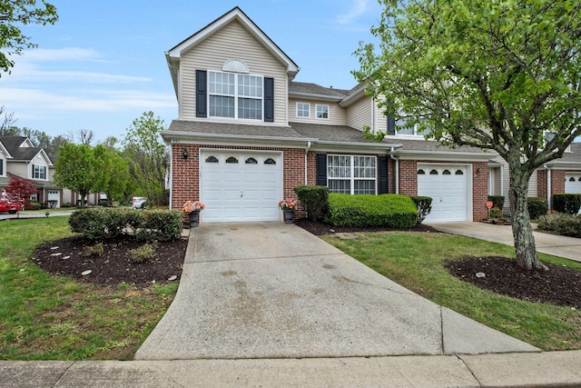traditional-style home featuring roof with shingles, a garage, driveway, and brick siding