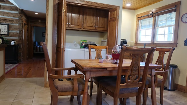 dining area featuring recessed lighting, light tile patterned flooring, and washer and clothes dryer