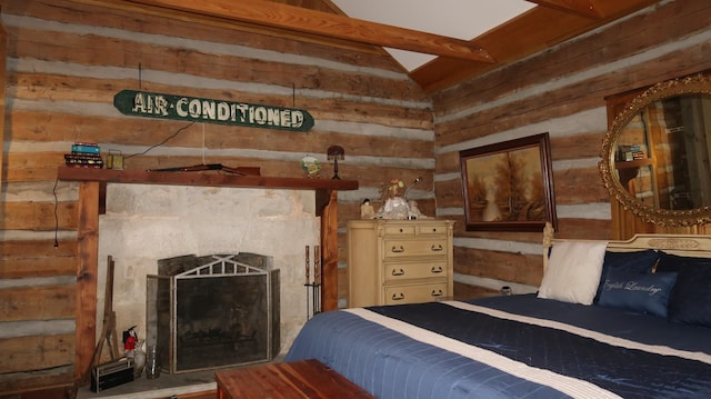 bedroom featuring wood walls, lofted ceiling, and a fireplace with raised hearth