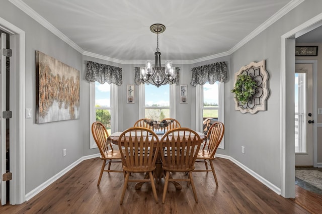 dining space with a notable chandelier, dark wood-type flooring, and a healthy amount of sunlight
