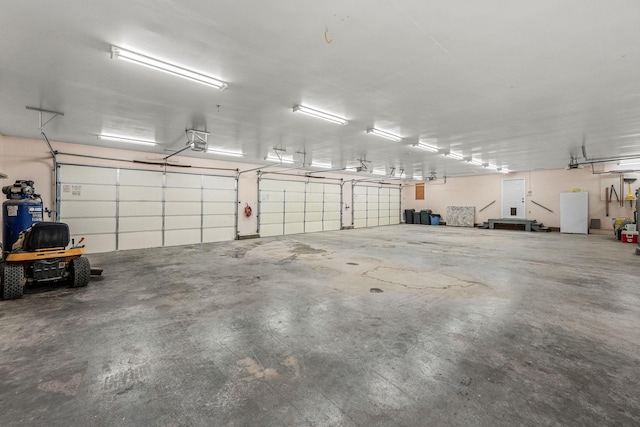 garage with fridge and a garage door opener