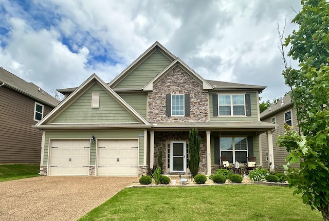 2006 Austin Dr, Spring Hill, TN 37174 - craftsman inspired home with stone siding, covered porch, a front lawn, and driveway