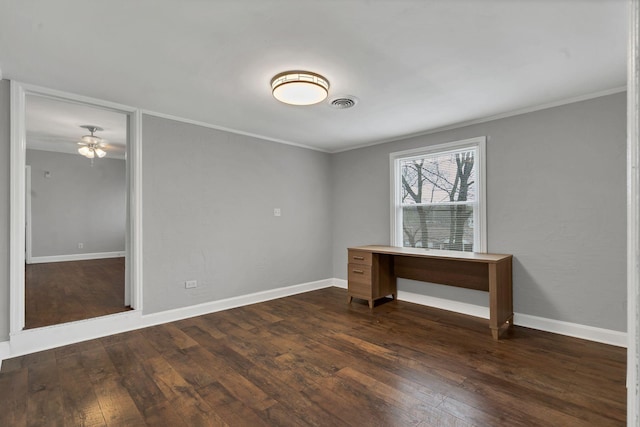 interior space with dark wood-style flooring, ornamental molding, baseboards, and visible vents