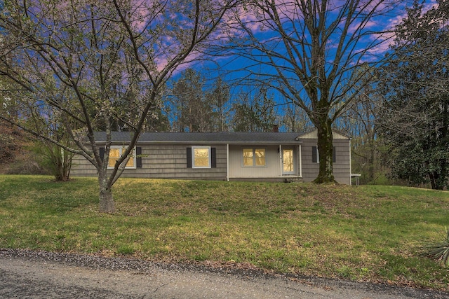 ranch-style house with a front yard