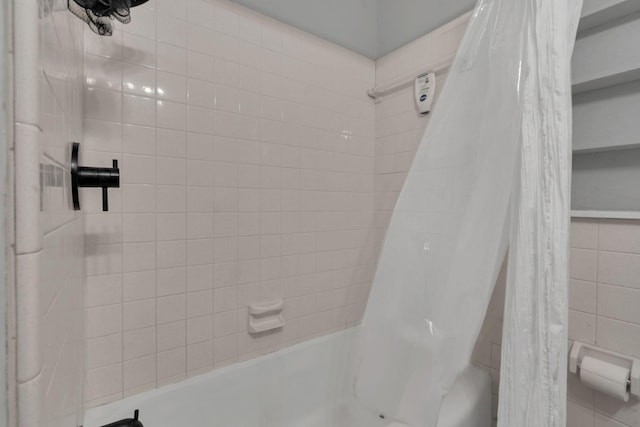 bathroom with shower / bathtub combination with curtain