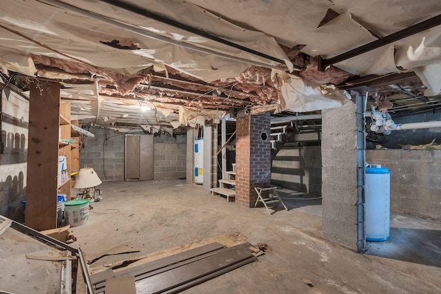 unfinished basement with electric water heater