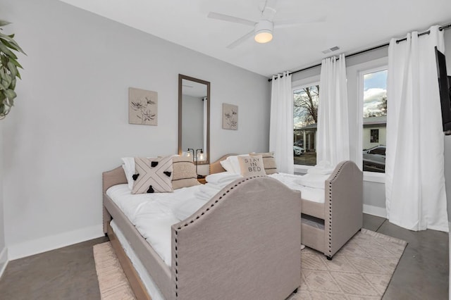 bedroom featuring baseboards, access to exterior, visible vents, and finished concrete floors