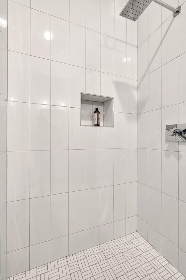 full bathroom with tiled shower