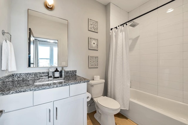 full bath featuring shower / bath combination with curtain, toilet, and vanity