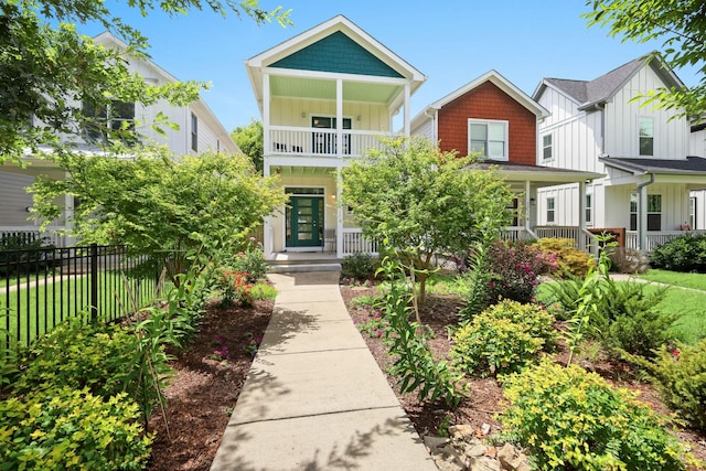 5311 Tennessee Ave Unit A, Nashville, TN 37209 - view of front of home featuring a balcony, covered porch, fence, and board and batten siding