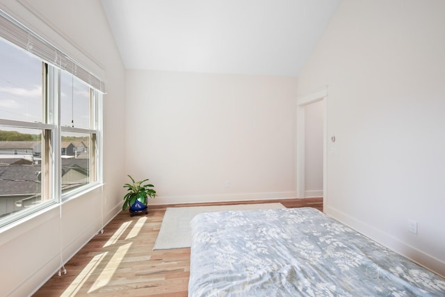 5311 Tennessee Ave Unit A, Nashville, TN 37209 - unfurnished bedroom with baseboards, lofted ceiling, and wood finished floors