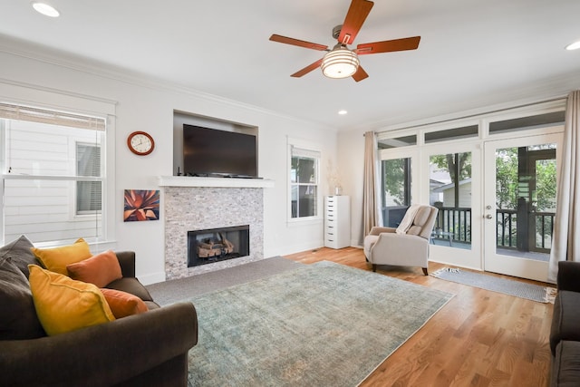 5311 Tennessee Ave Unit A, Nashville, TN 37209 - living area with crown molding, recessed lighting, ceiling fan, a tiled fireplace, and wood finished floors