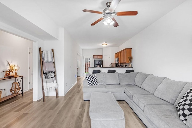 284 Meigs Dr Unit C21, Murfreesboro, TN 37128 - living room with light wood finished floors, baseboards, and a ceiling fan
