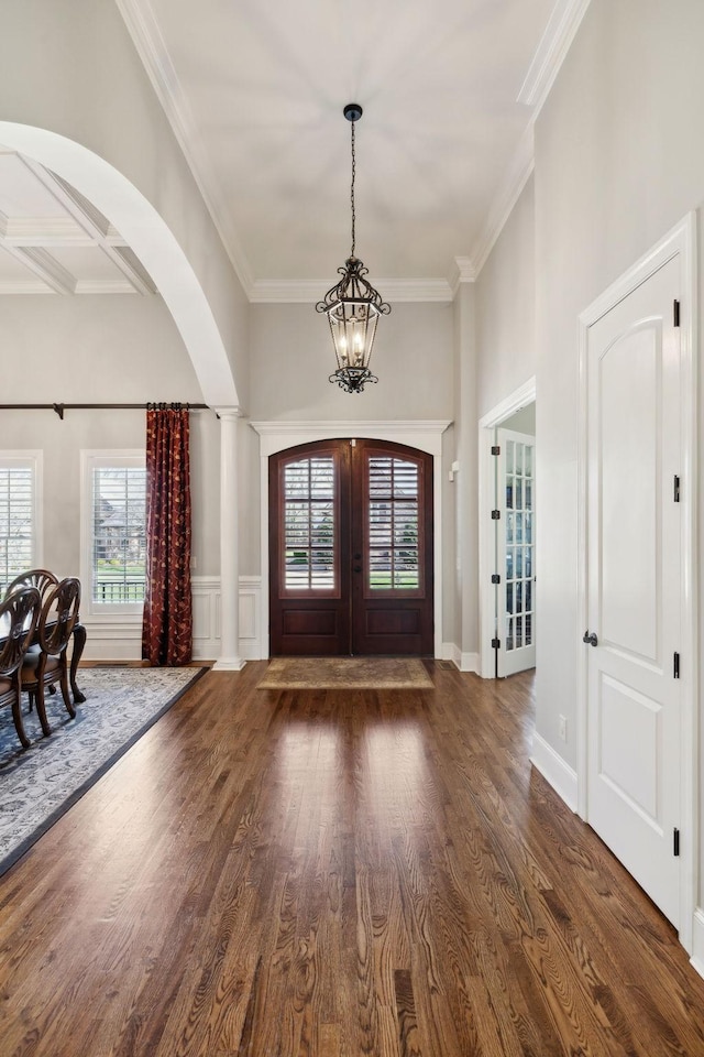 1194 Meadow Bridge Ln, Arrington, TN 37014 - foyer featuring an inviting chandelier, arched walkways, a healthy amount of sunlight, and wood finished floors
