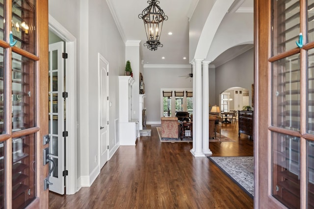 1194 Meadow Bridge Ln, Arrington, TN 37014 - entrance foyer with recessed lighting, ornate columns, ornamental molding, dark wood-type flooring, and arched walkways