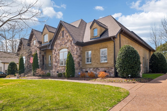 1194 Meadow Bridge Ln, Arrington, TN 37014 - view of front facade with a front yard, stone siding, and roof with shingles