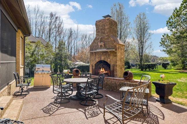 1194 Meadow Bridge Ln, Arrington, TN 37014 - view of patio featuring an outdoor brick fireplace, outdoor dining area, grilling area, and fence