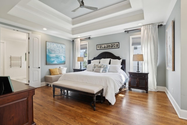 1194 Meadow Bridge Ln, Arrington, TN 37014 - bedroom featuring a tray ceiling, baseboards, wood finished floors, and ornamental molding
