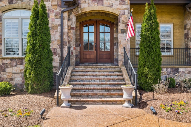 1194 Meadow Bridge Ln, Arrington, TN 37014 - view of exterior entry with stone siding and french doors